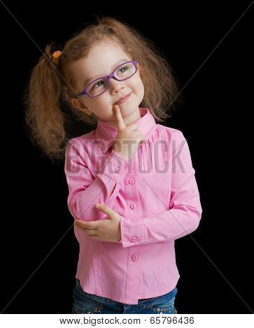 Adorable child girl in eyeglasses isolated on black