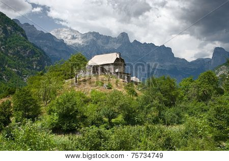 house on the hill in Theth valley, Albania