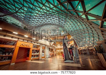 WARSAW, POLAND - NOV 1: The shopping mall, called Golden Terraces, with modern architecture at night in Warsaw, Poland on November 1, 2014. It is a major mall next to the central station.