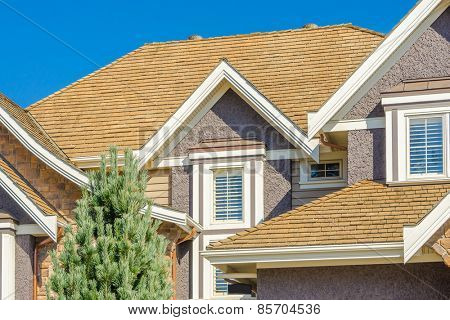 The roof of the house with nice window.