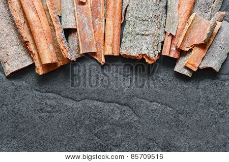 Cinnamon Sticks On The Dark Background