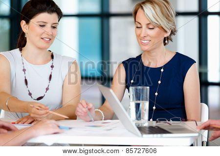 Businesswoman doing a presentaion in front of her collegues