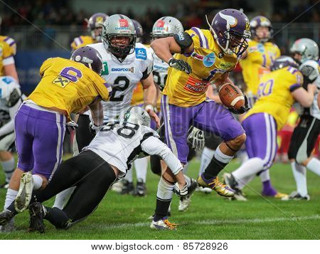 VIENNA, AUSTRIA - MARCH 23, 2014: RB Emmanuel Pan-Sok Moody (#1 Vikings) runs with the ball in an AFL football game.