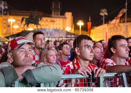 ZAGREB, CROATIA - JUNE 12, 2014: Croatian football fans at Ban Josip Jelacic square support their national team during the world cup match between Croatia and Brazil.