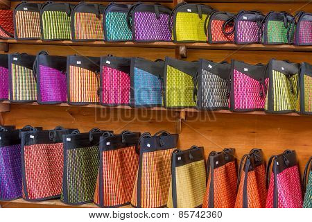 traditional straw bags in souvenir shop