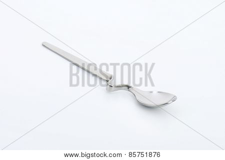 empty squiggly spoon on white background