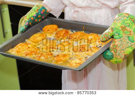Woman holds homemade roasted meat