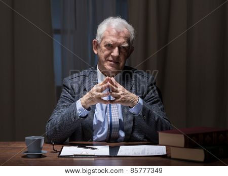 Businessman Sitting At The Desk