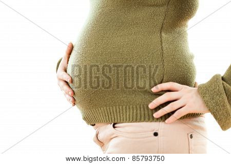 Pregnant woman holding stomach