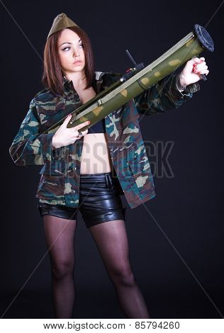 Young Woman In The Military Uniform With The Bazooka