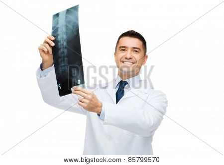 healthcare, rontgen, people and medicine concept - smiling male doctor in white coat with x-ray