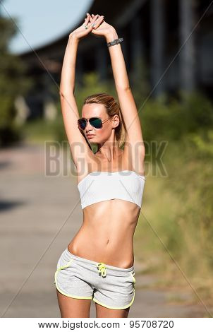 Attractive Fit Woman In Sportswear Training Outdoors