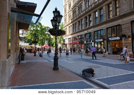 Beggar Woman Praying On The Street