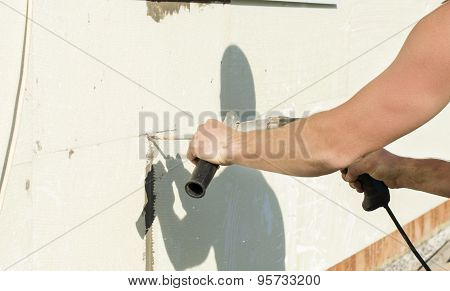 The Process Of Drilling Holes In The White Polyfoam