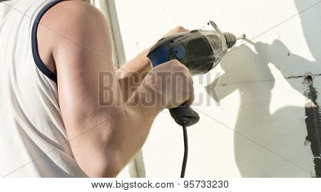 The Process Of Drilling Holes In The White Polyfoam