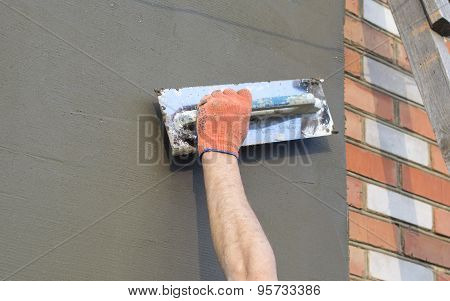 The Process Of Applying Putty With A Spatula