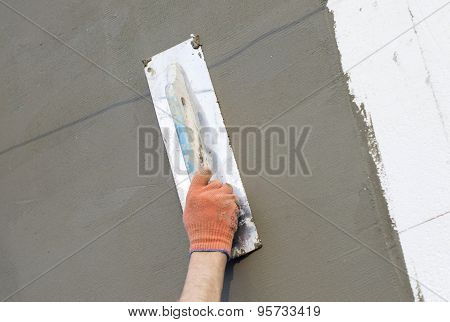 The Process Of Applying Putty To The  Polyfoam Wall