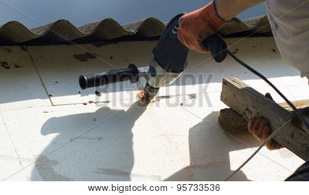 The Process Of Drilling Holes In The White Polyfoam