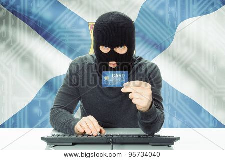Hacker Holding Credit Card And Canadian Province Flag On Background - Nova Scotia