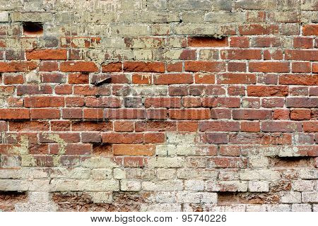 Broken Old Bricklaying From Red White Bricks And Damaged Plaster