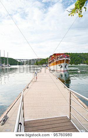Krka, Croatia - 21 August 2014: tourists on a boat at the river who takes to the Krka national park on Croatia
