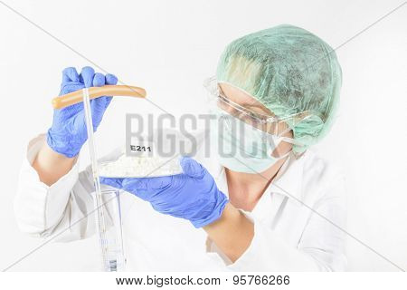 Researcher presenting preservatives substances that are added to products such as foods, pharmaceuticals, paints, biological samples, wood etc