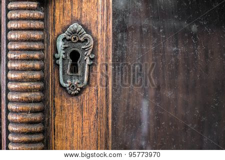 Keyhole of antique wooden cabinet