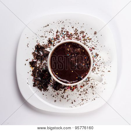 white cup of hot chocolate and sauser isolated