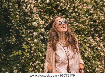 Bohemian Young Woman Among Flowers Looking Up On Copy Space