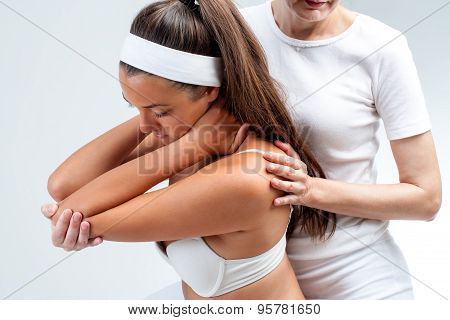 Osteopathic Therapist Doing Shoulder Rotation.