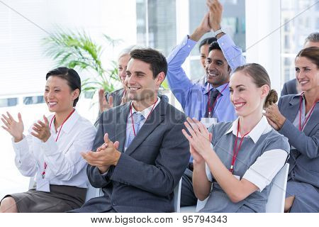Business team applauding during conference in the office