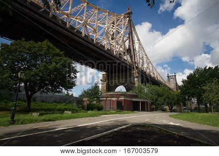 Queensboro bridge and the street at the park, New York