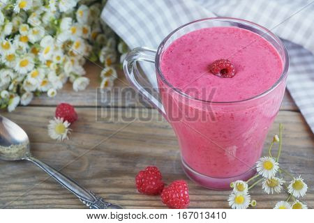 Delicious raspberry smoothie or milk shake with fresh berries. Fresh yogurt with raspberry. Healthy breakfast.