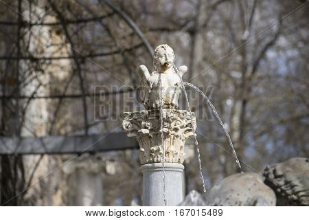 Sculpture of angel winged in the royal gardens of the palace of aranjuez in madrid, spain