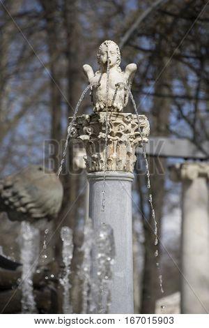 Sculpture of angel winged in the royal gardens of the palace of aranjuez in madrid, spain