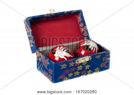 Chinese health balls in box. Isolated on white background.