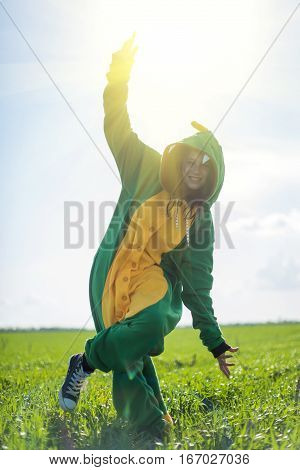 Dragon kigurumi on the green fild, girl