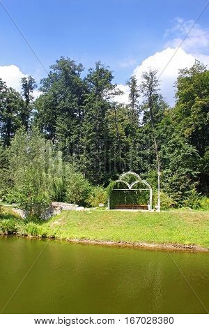 Fresh green arbor and pond, Feofaniya, near Kyiv, Ukraine