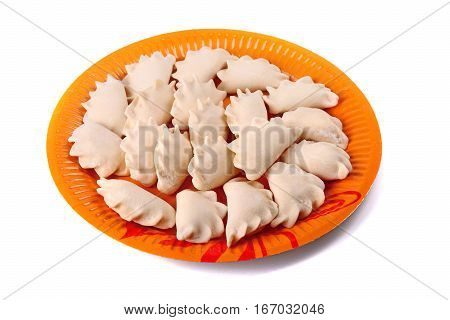Frozen Vareniki Laying On The Orange Plate