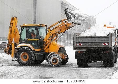 Snow plow outdoors cleaning street