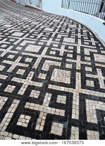 Typical Portuguese black and white stone mosaic 