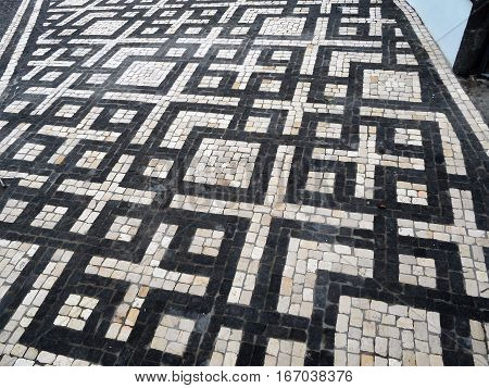 Typical Portuguese black and white stone mosaic 