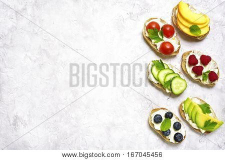 Assortment Of Fruit And Vegetable Toasts.top View With Space For Text.