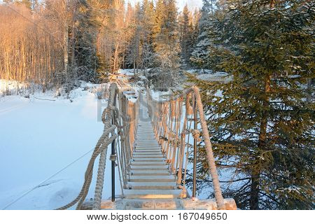Cable bridge under the waterfall near the Ruskeala kanyon, Karelia republic