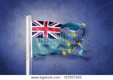 Torn flag of Tuvalu flying against grunge background