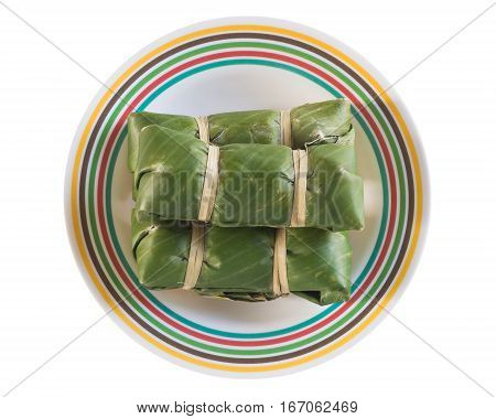 sour pork on banana leaf. pork shredded and salted. bound tightly with banana leaves and eaten slightly fermented.