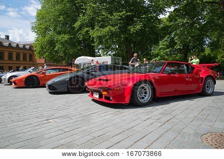 TURKU, FINLAND - JUNE 13, 2015: Parade of rare sports cars in one of the squares of Turku summer day