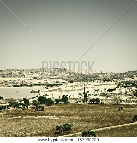 Spanish Landscape with Lake and City in the Autumn Vintage Style Toned Picture