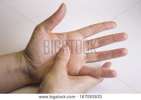 Hands of caucasian woman selfmassage. Relax scene