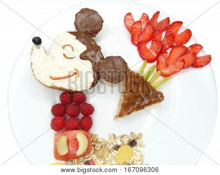 creative breakfast food with fruit and chocolate sweet cream on bread